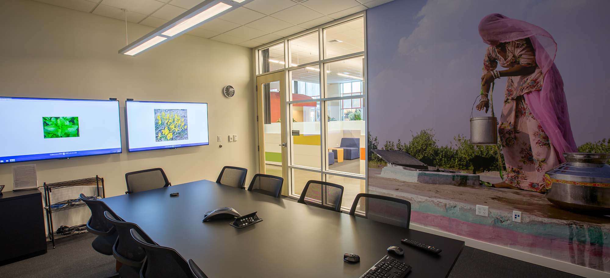 Control4 Touch panel in a able with a traditional home in the background